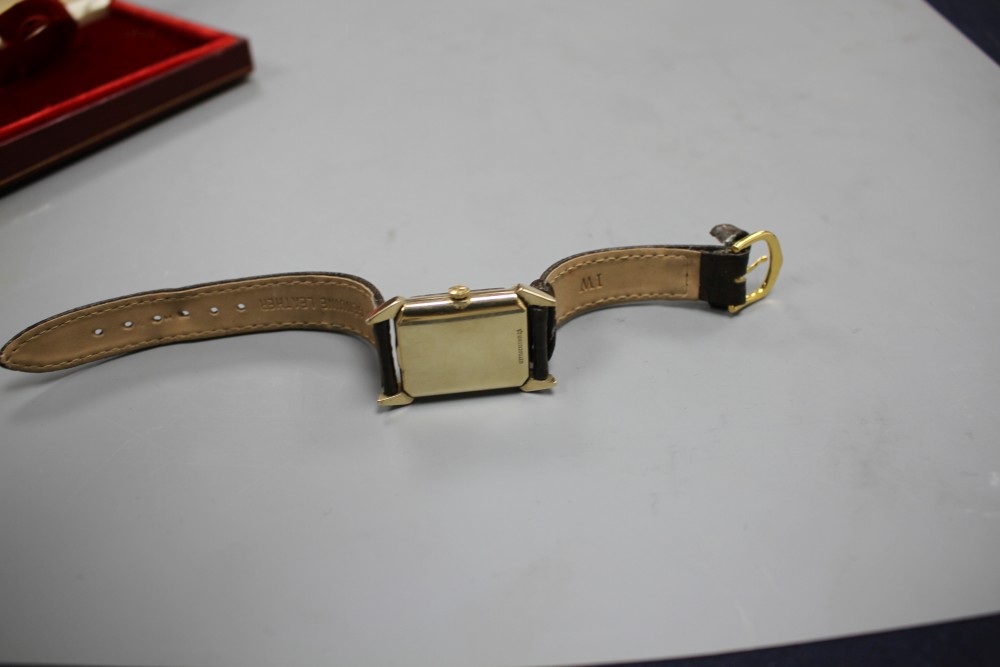 A gentlemans 1940s 10k gold filled Longines manual wind wrist watch, with rectangular Arabic and baton dial